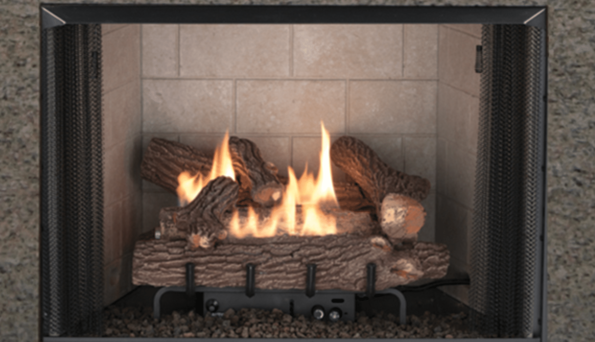 Ventless fireplace with logs and yellow flame.