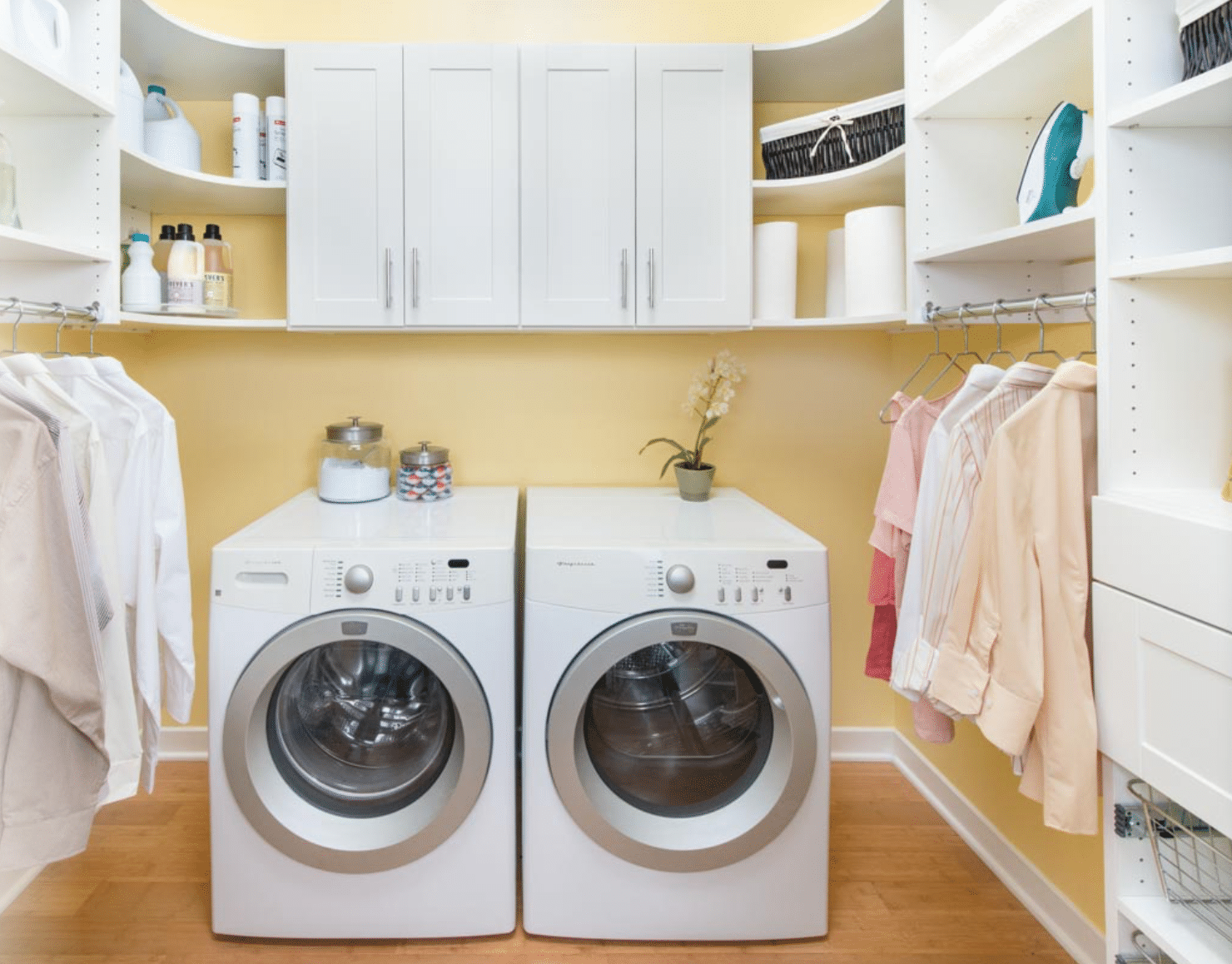 laundry room with washer dryer and custom white wood shelves