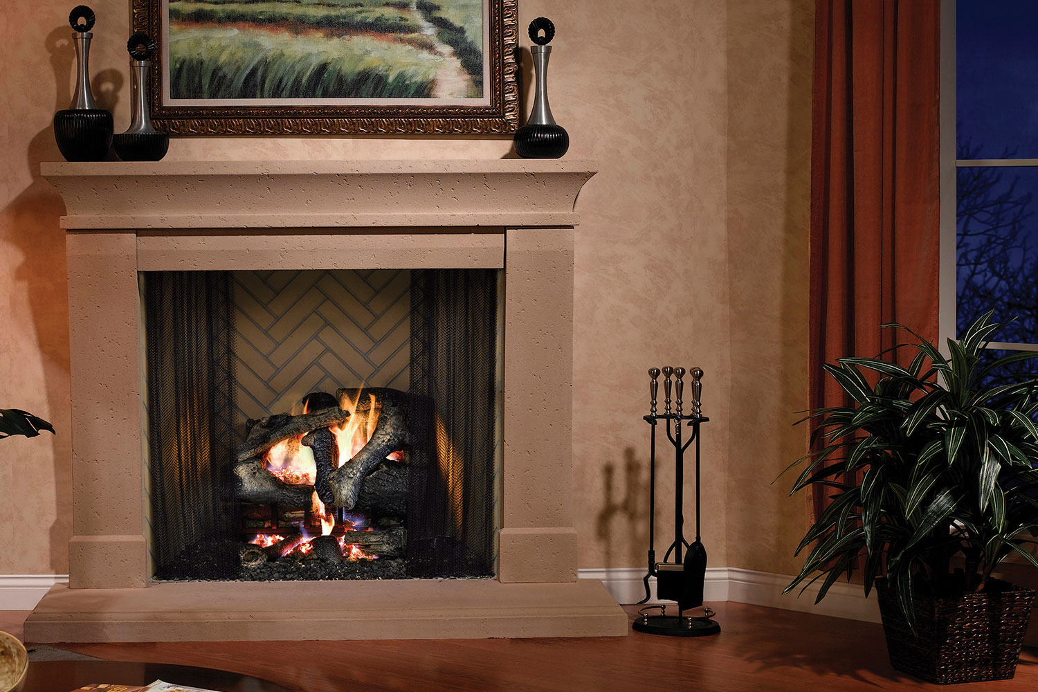 Wood fireplace burning in smooth tan insert with herringbone tile interior, in a living room.
