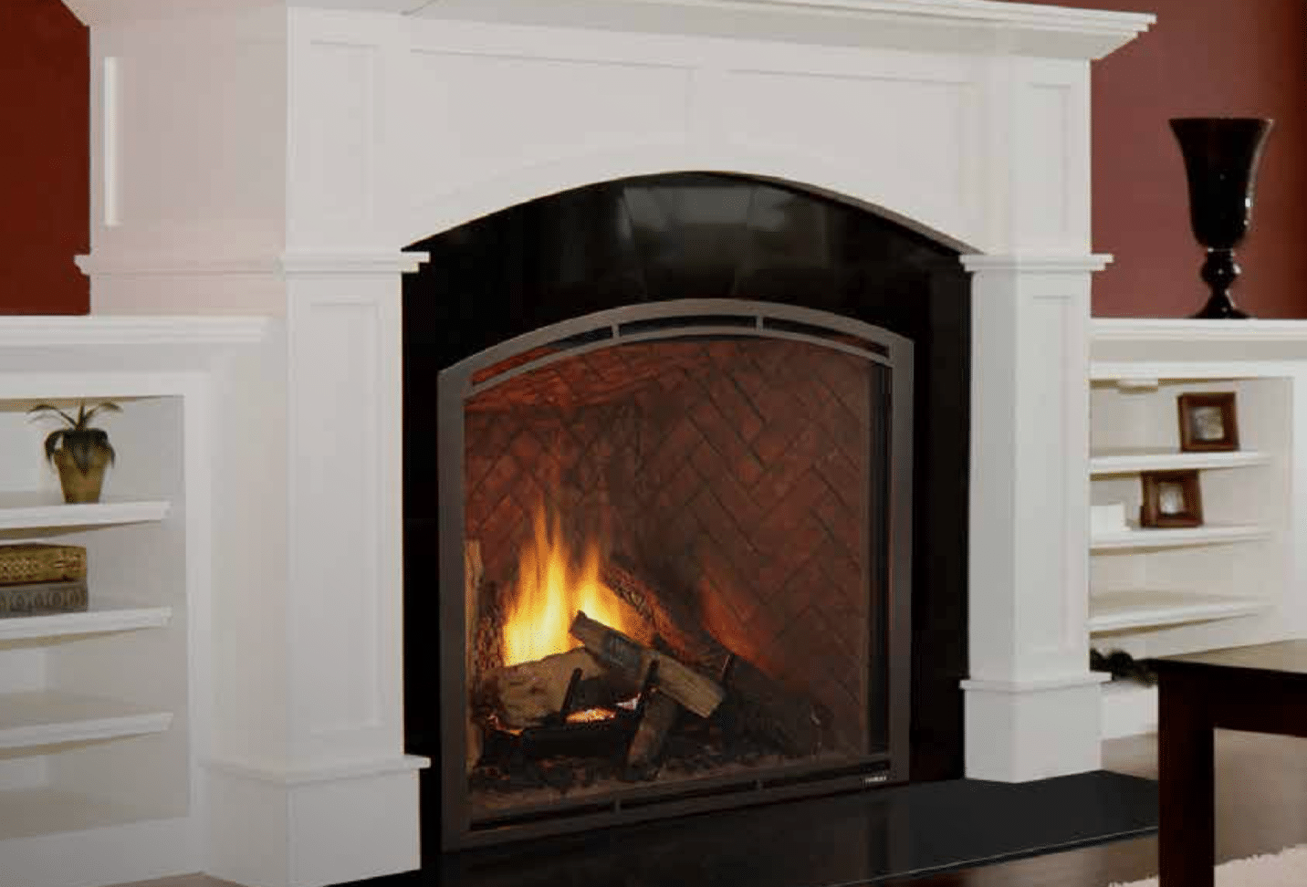 wood burning fire place with white traditional mantle